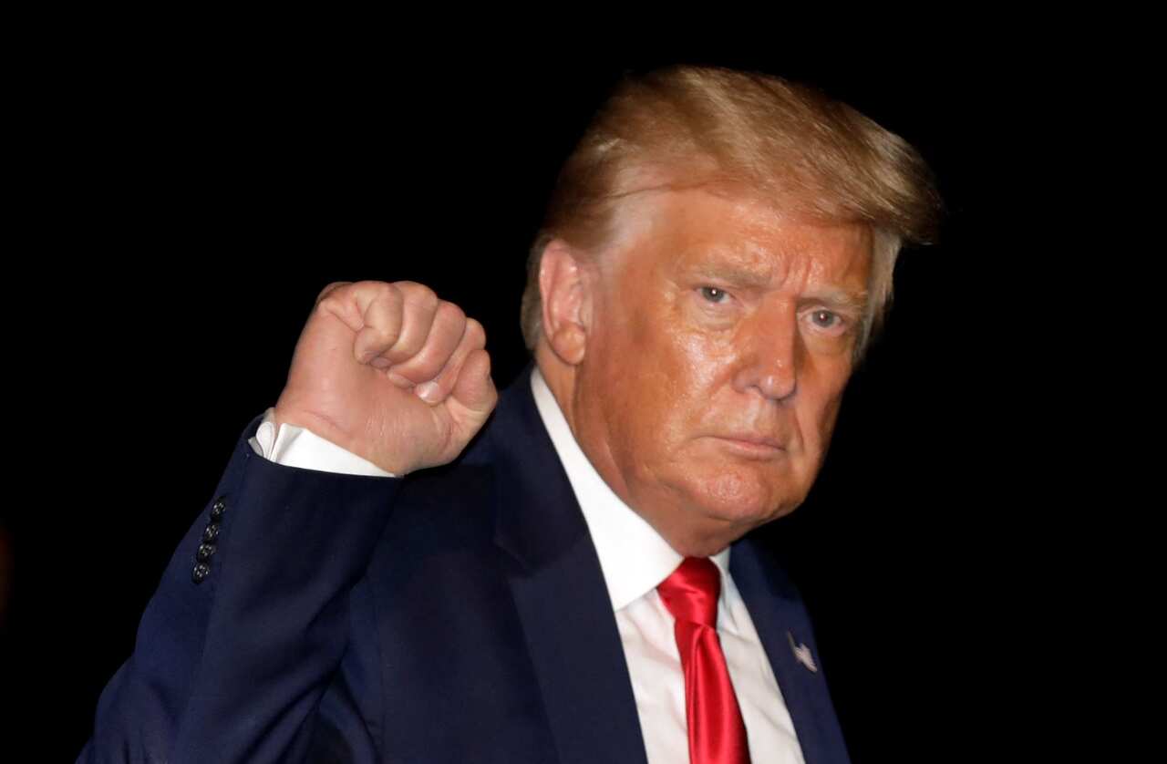 United States President Donald Trump gestures on the South Lawn on his arrival at the White House in Washington, DC, USA, 31 July 2020.