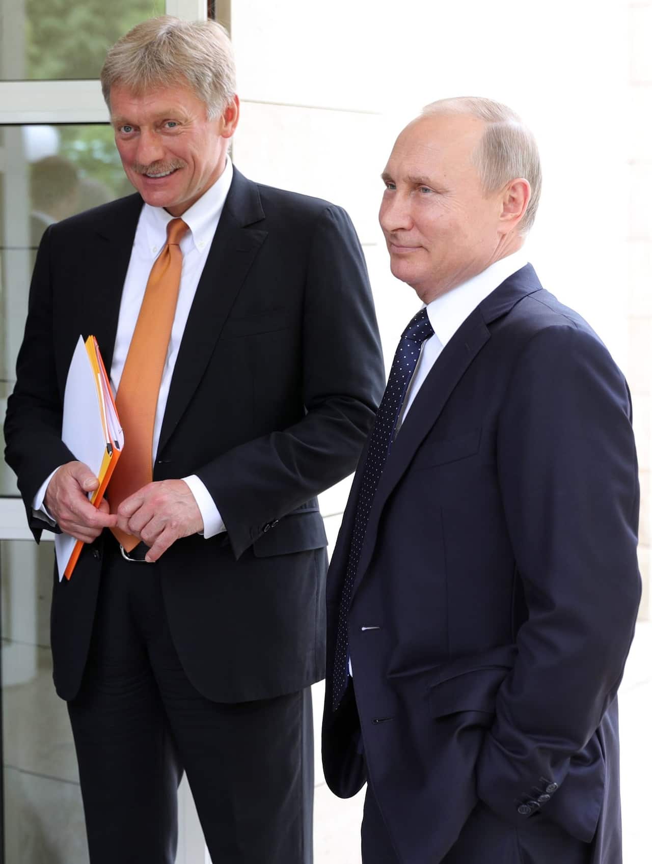 President Vladimir Putin with his press secretary, Dmitry Peskov. Mr Peskov had an aide contact Mr Cohen to discuss the tower project.