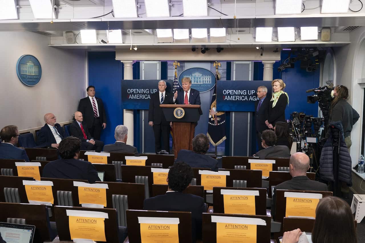 US President Donald Trump holds a news briefing with members of the Coronavirus Task Force at the White House. 