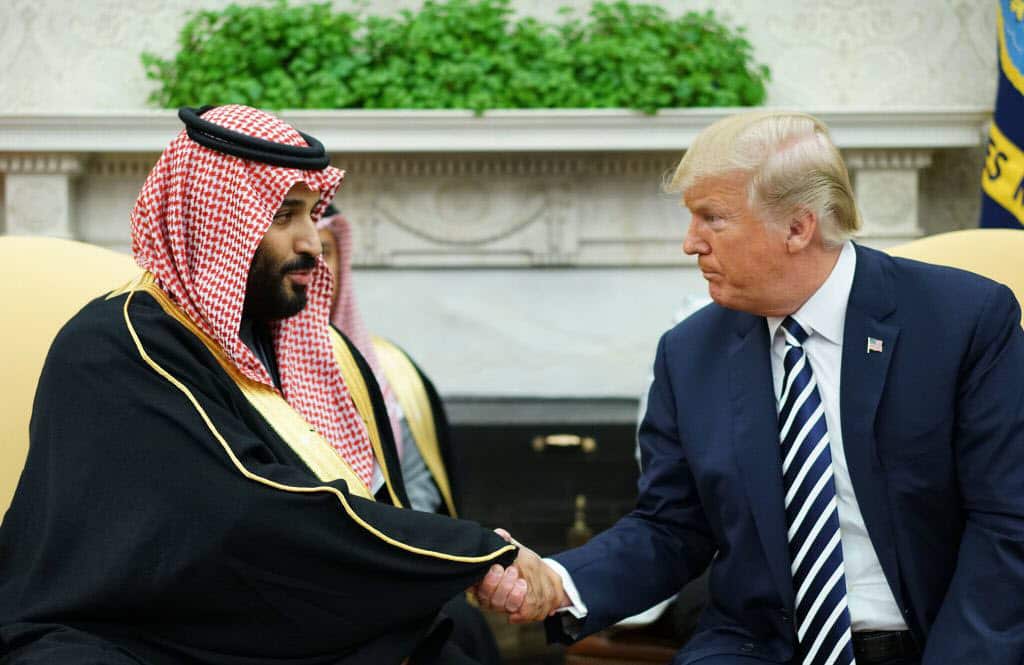 Donald Trump (R) shakes hands with Saudi Arabia's Crown Prince Mohammed bin Salman