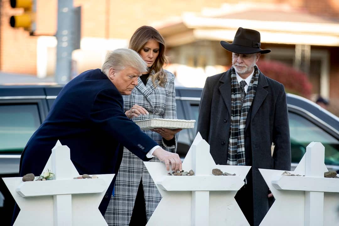 President Donald Trump, accompanied by first lady Melania Trump, and Tree of Life Rabbi Jeffrey Myers