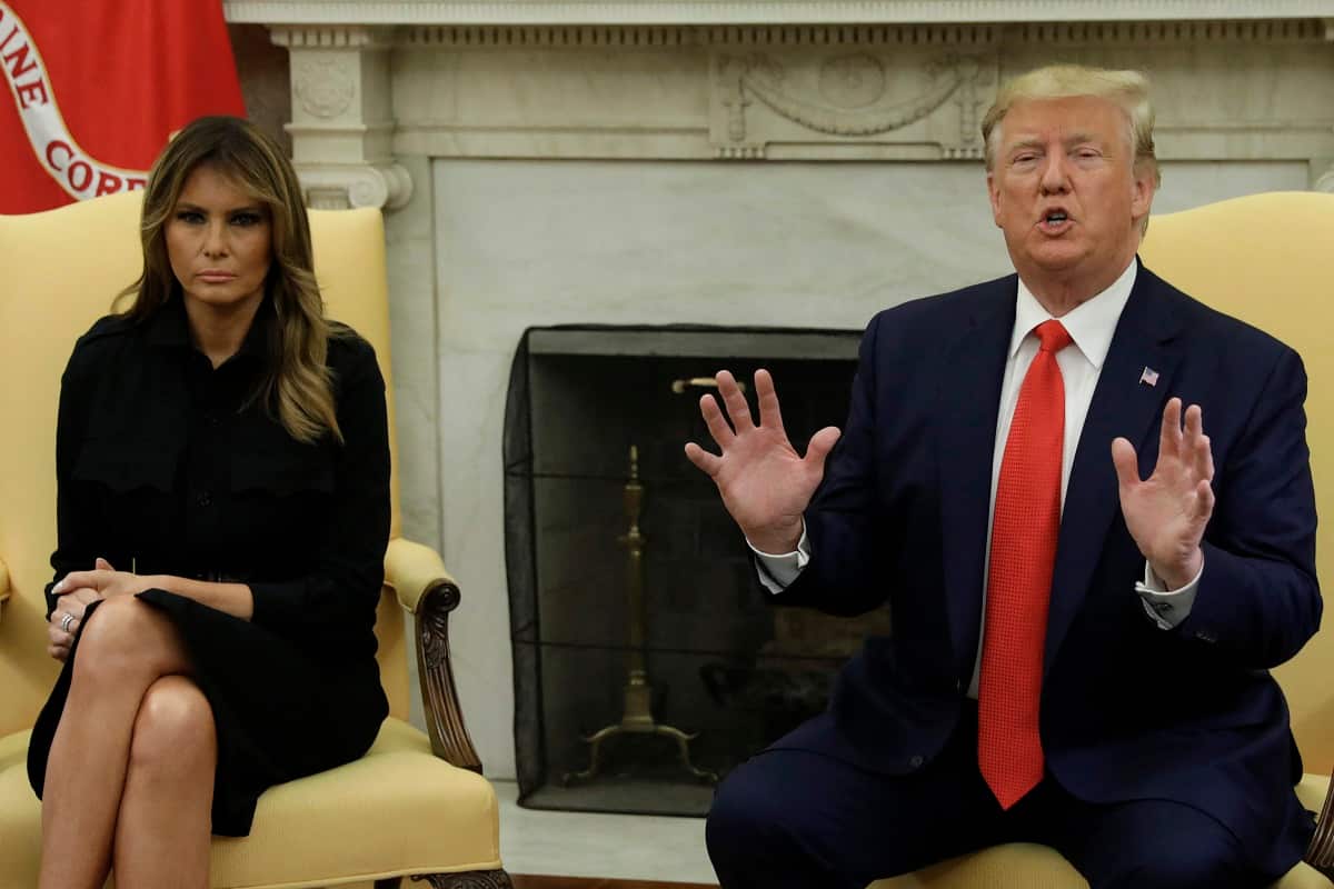 U.S. President Donald Trump talks to the media next to First Lady Melania Trump during a meeting about vaping in the the Oval Office at the White House.