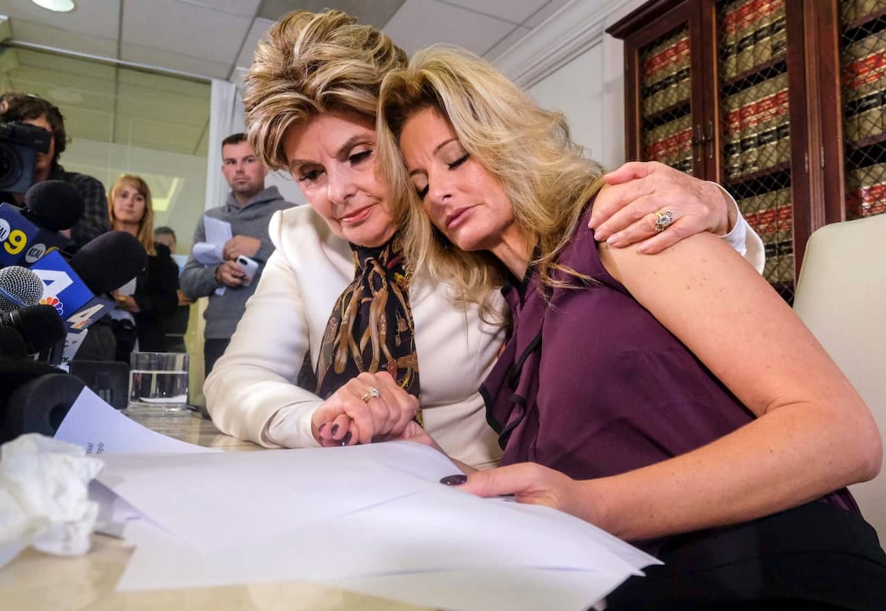 Attorney Gloria Allred, left, comforts Summer Zervos during a news conference in Los Angeles, Friday Oct. 14, 2016. 