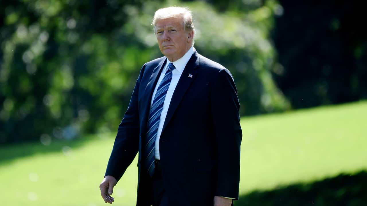 US President Donald Trump walks on the South Lawn.