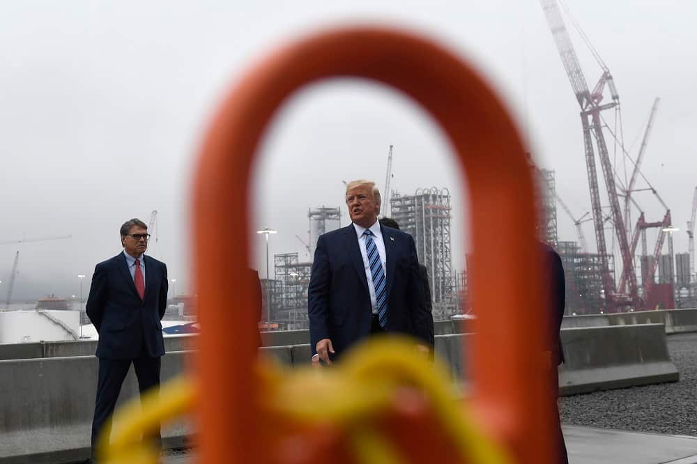 President Donald Trump views a construction sight, Tuesday, Aug. 13, 2019.