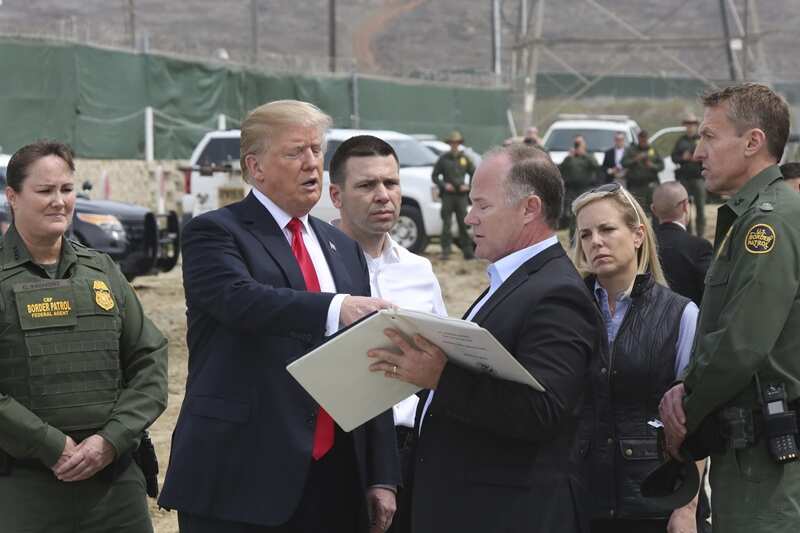 Project Manager James O'Loughlin explaining Border Wall prototypes to President Donald Trump. 