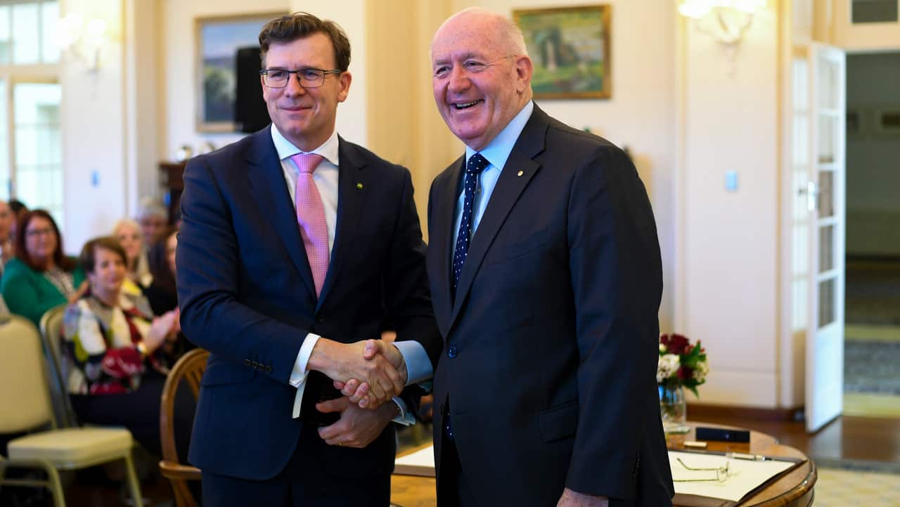 Alan Tudge MP (left) shakes hands with Australian Governor-General Sir Peter Cosgrove after being sworn-in as Australian Minister for Cities.