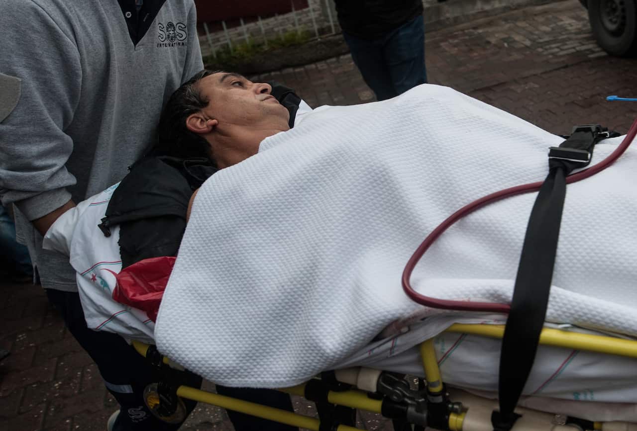 A Turkish medic pulls Abraham Rahmi, an Israeli tourist, into Sisli Etfal Hospital close the scene of an explosion, in Istanbul, Turkey
