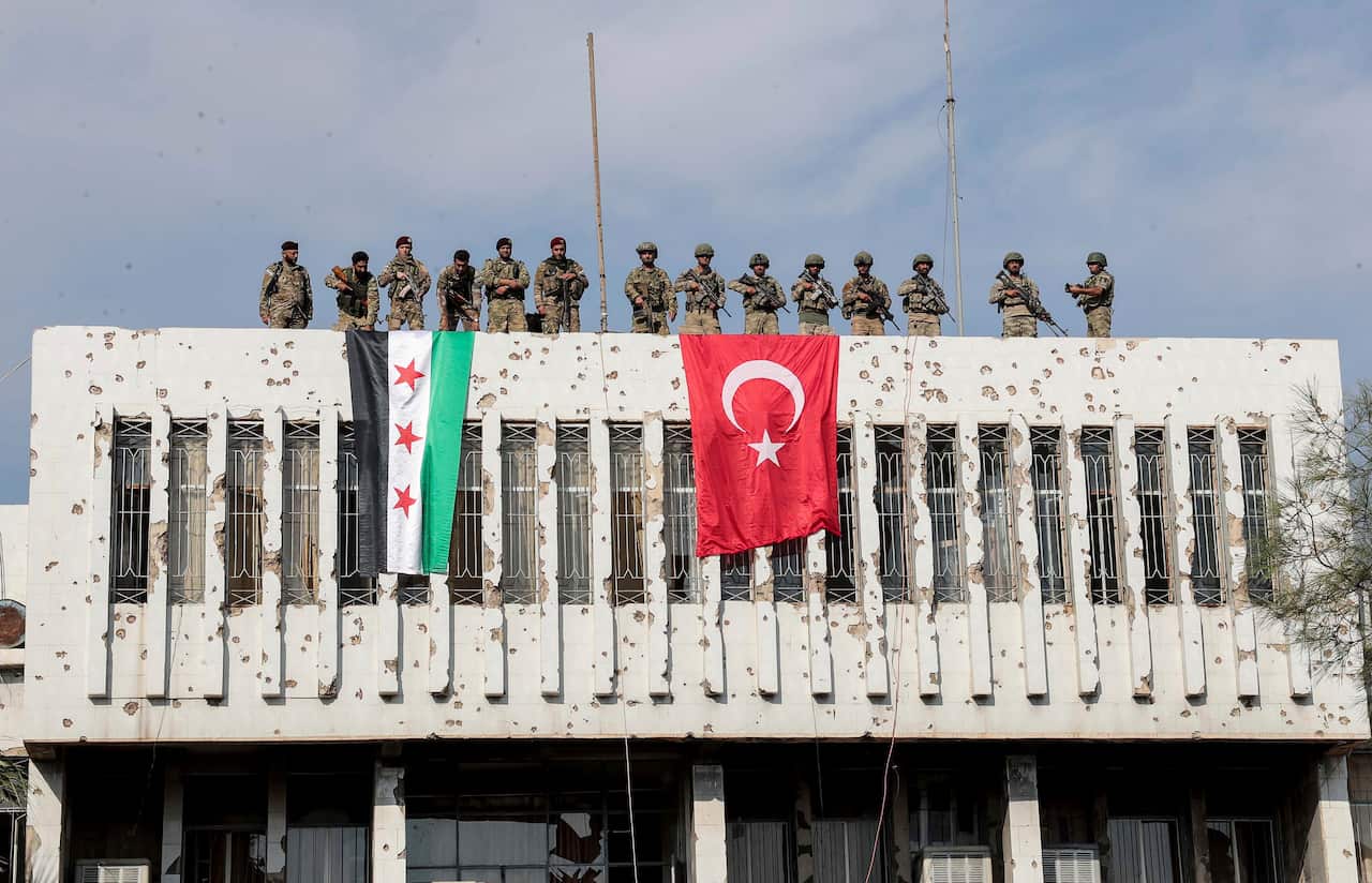 Turkish soldiers, with pro-Turkish Syrian paramilitaries during Turkey’s recent offensive into Syria.