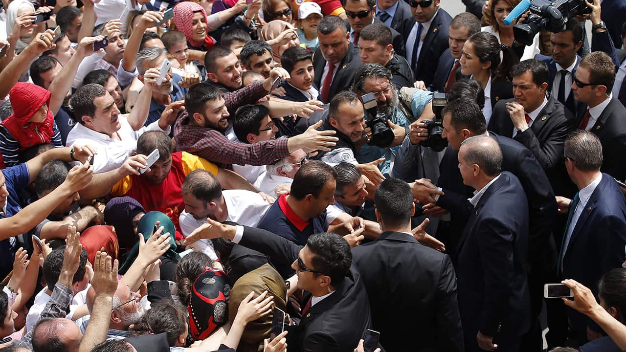 Supporters greet President Erdoğan in Istanbul, as he votes in the 2015 legislative election.