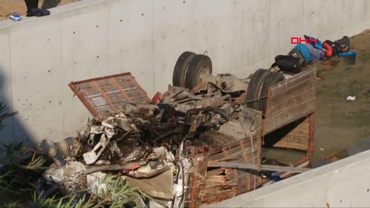 The truck flipped and fell into the river several metres below the road.