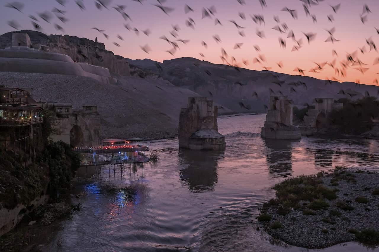 Birds fly over the Tigris River near Hasankeyf, Turkey, Nov. 3, 2019.
