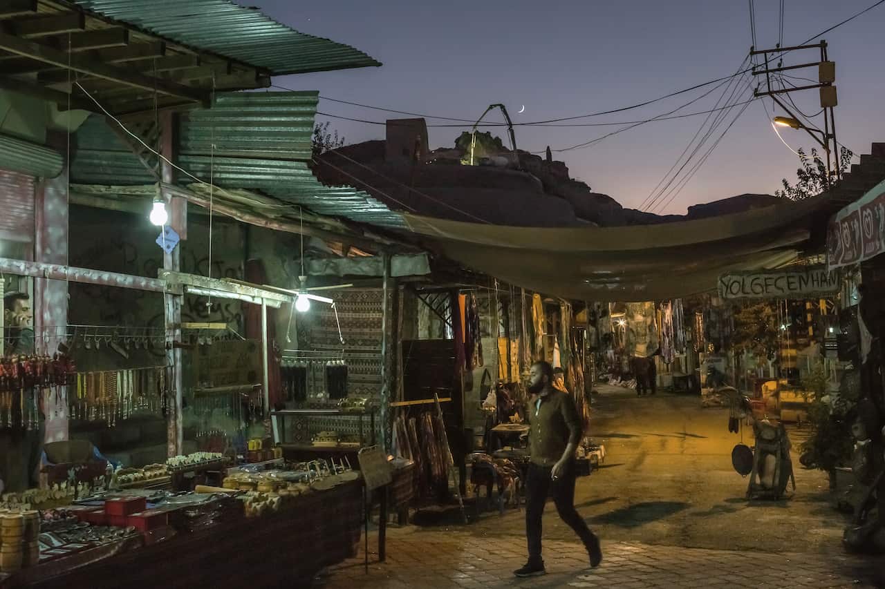 A resident walks through the old bazaar of Hasankeyf, Turkey, the day before demolition began on it, Oct. 30, 2019.