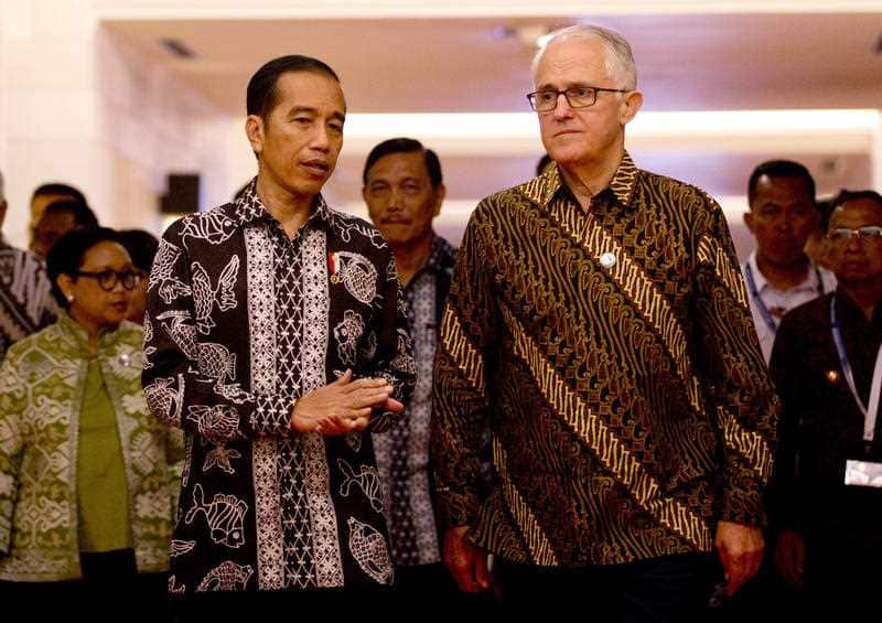 Indonesia President Joko "Jokowi" Widodo walks with former Prime Minister Malcolm Turnbull.