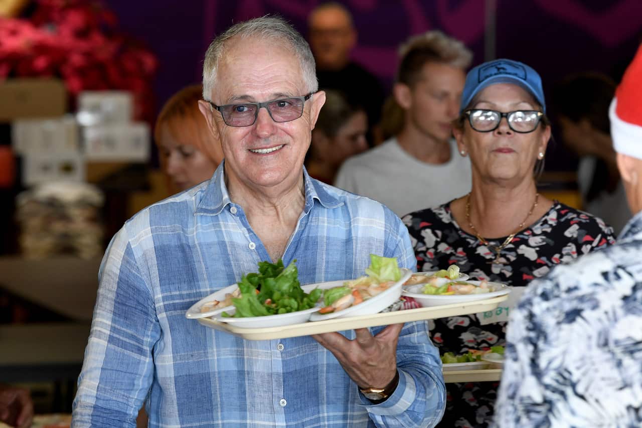 The former-PM handing out food at Wayside Chapel.