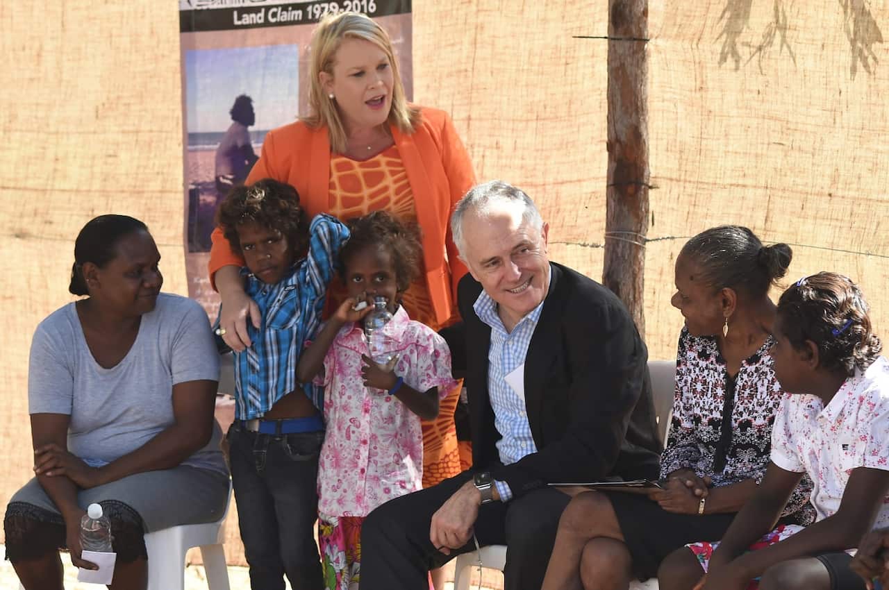Australian Prime Minister Malcolm Turnbull speaks to locals as he attends the Kenbi Native land claim ceremony near Darwin, Tuesday, June 21, 2016.