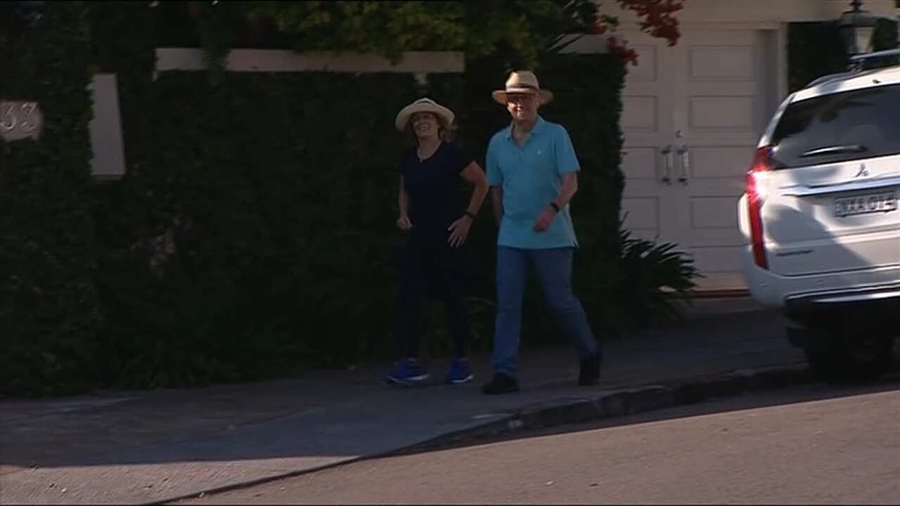 Malcolm Turnbull was all smiles as he went for a stroll with wife Lucy.