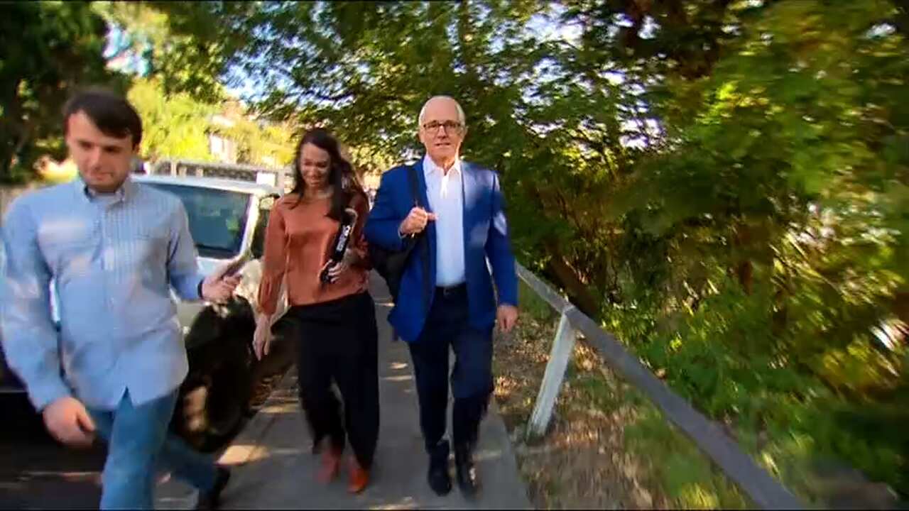 Malcolm Turnbull is questioned by reporters on morning walk