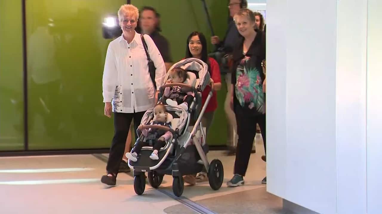 The 15-month-old sisters leave the Royal Children's Hospital after the successful operation. 