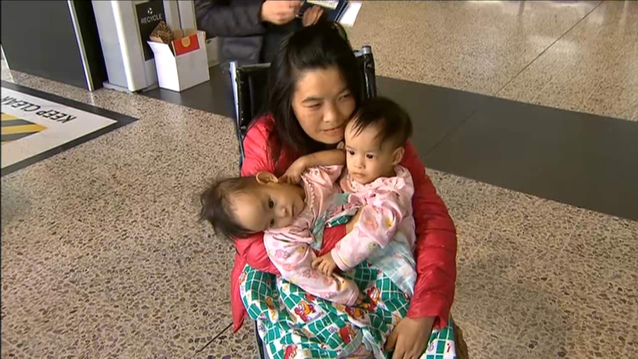 Nima and Dawa Pelden with mum arrive at Melbourne airport.