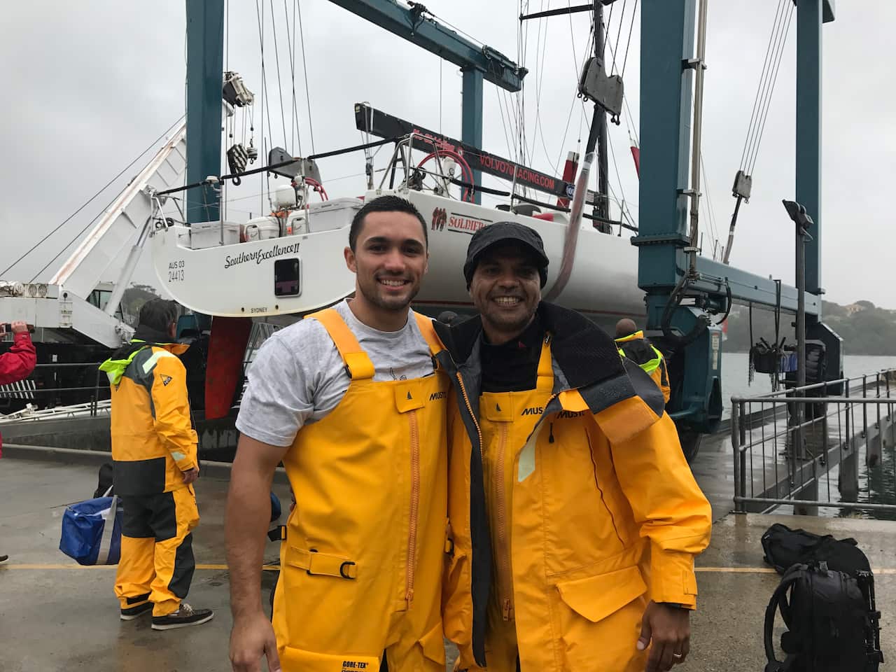 two indigenous crew members, boat  