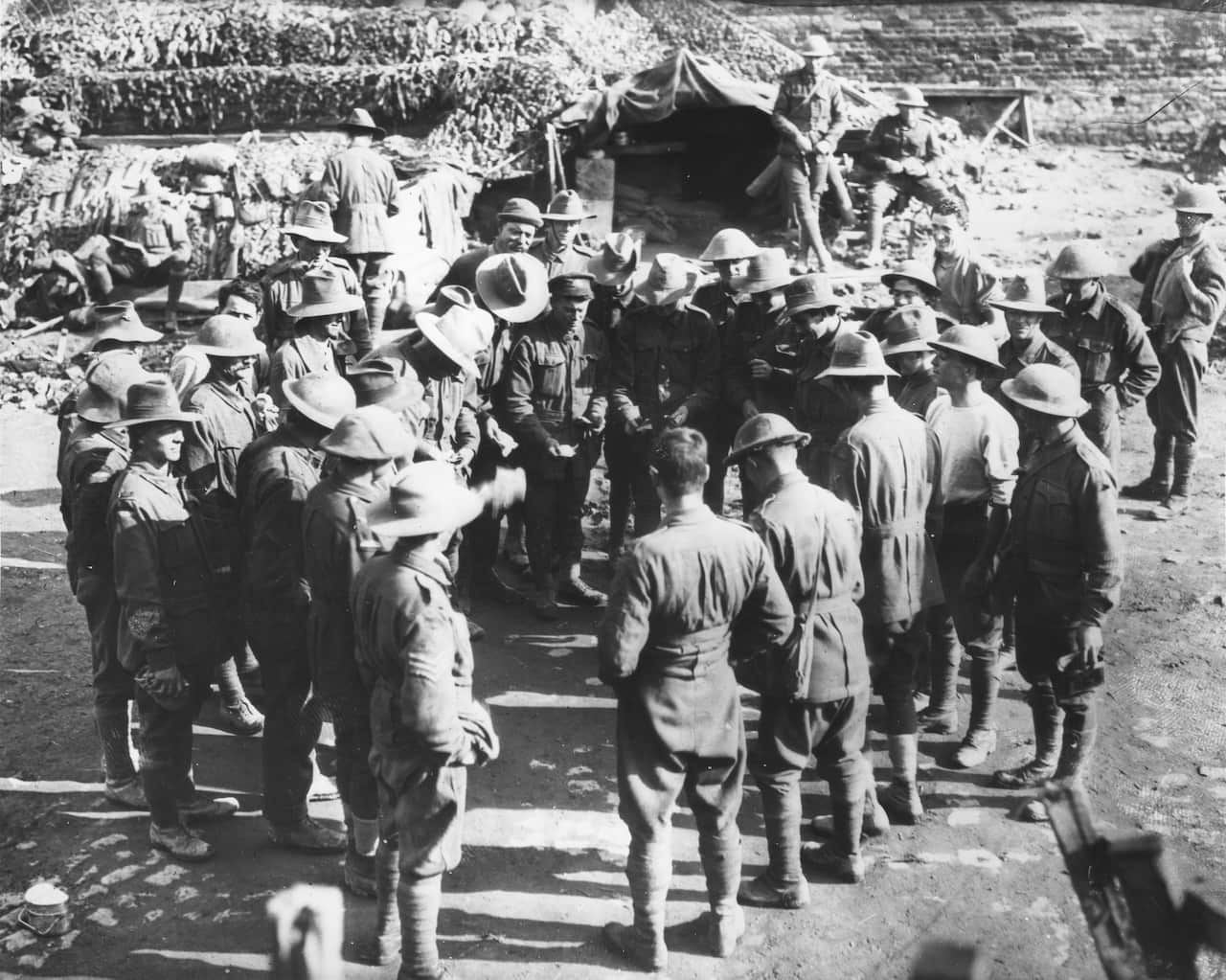 Australian troops playing a game of Two-up on the Western Front in Belgium during World War I in 1917 (AAP)