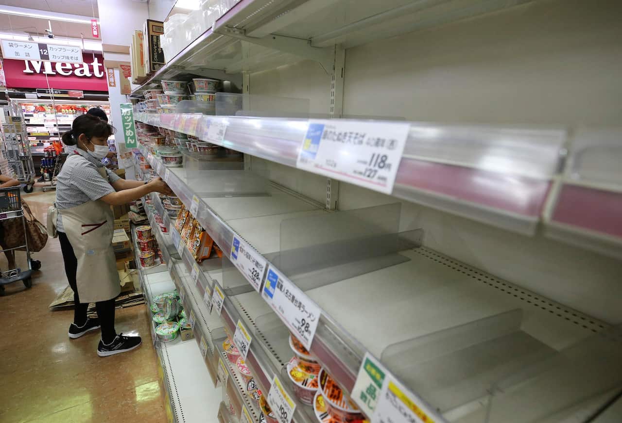 Store shelves are empty at a supermarket in Amami City, Kagoshima Prefecture, southwest of Japan.