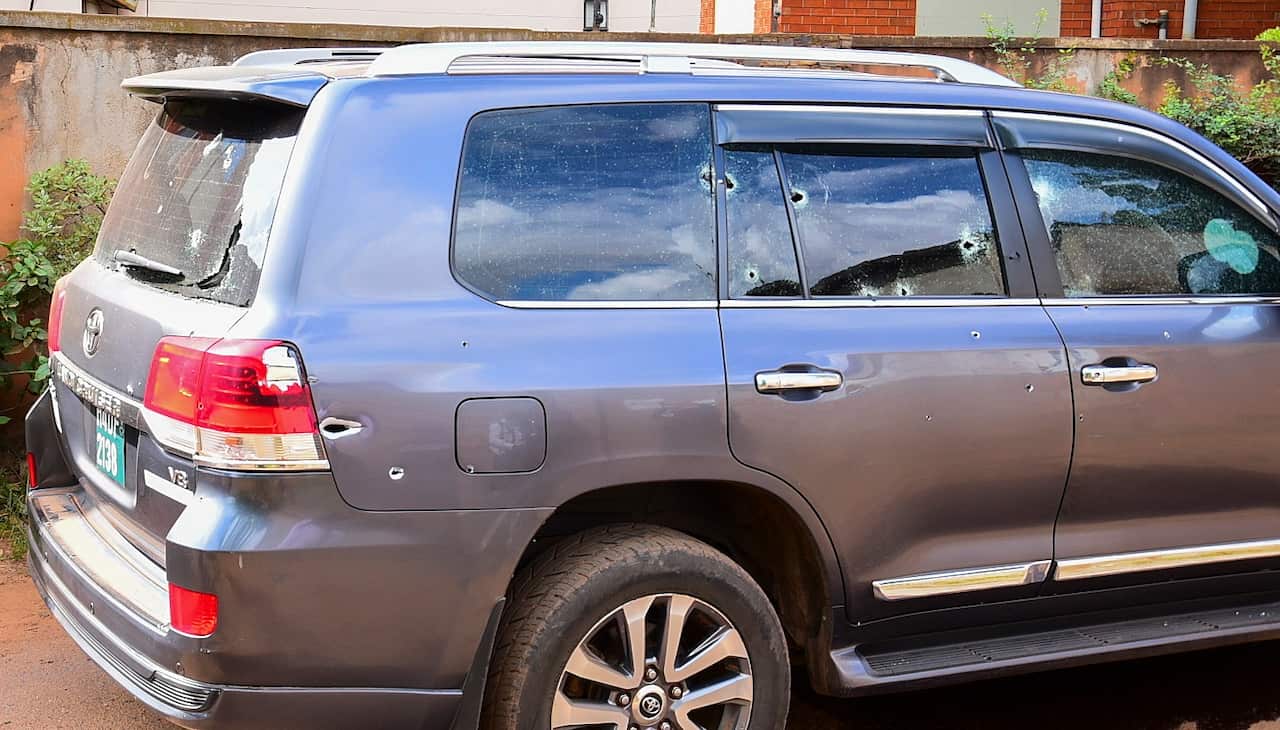 Uganda police at the scene of a shooting of General Katumba Wamala's car in Kiasasi, Kampala, Uganda.