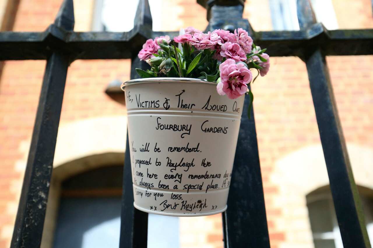 Flowers and a message left at the Abbey gateway of Forbury Gardens.