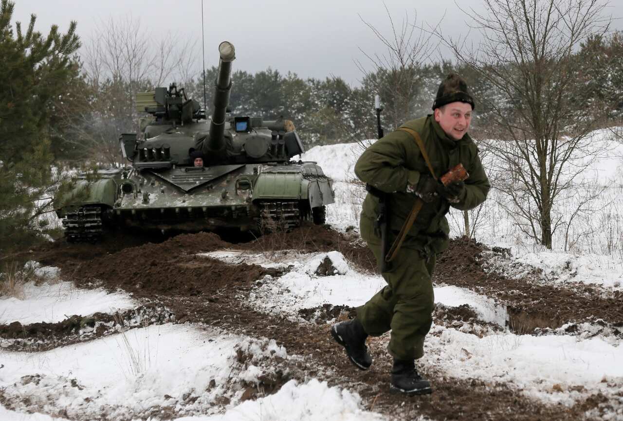 Mobilised Ukrainian soldiers shows his skills during military drills at a base in Desna 100km north from Kiev (AAP)