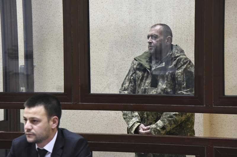 One of the captured Ukrainian sailors speaks in a court room in Simferopol, Crimea.