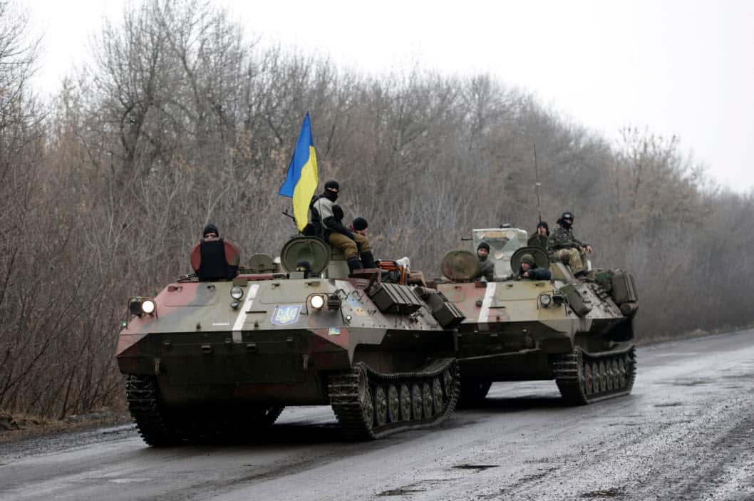 A Ukranian armored vehicle is towed on the road towards the town of Artemivsk, Ukraine (AAP)