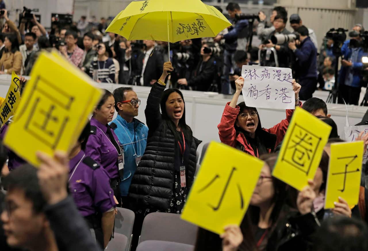 Protesters against election winner Carrie Lam