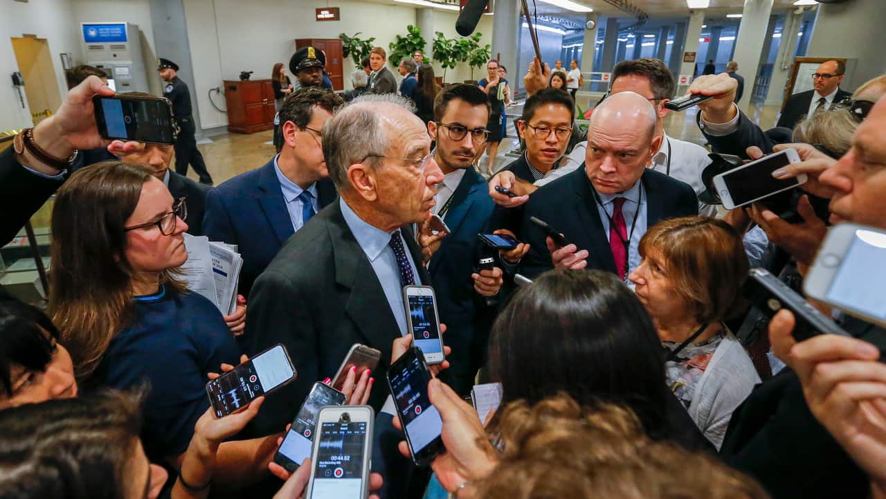 Republican Iowa Senator Chuck Grassley stops to speak briefly with the media at US Capitol on 3 October 2018.  