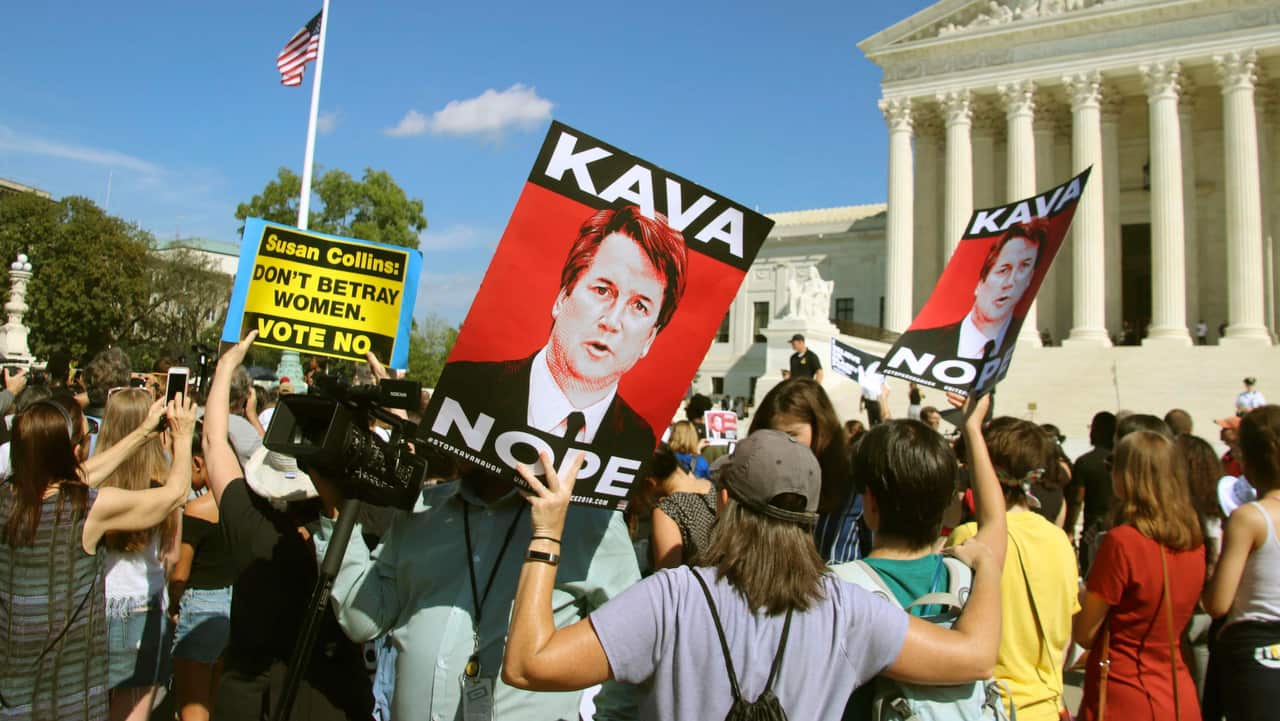 Protesters demonstrate in front of the U.S. Supreme Court in Washington on October 4, 2018.