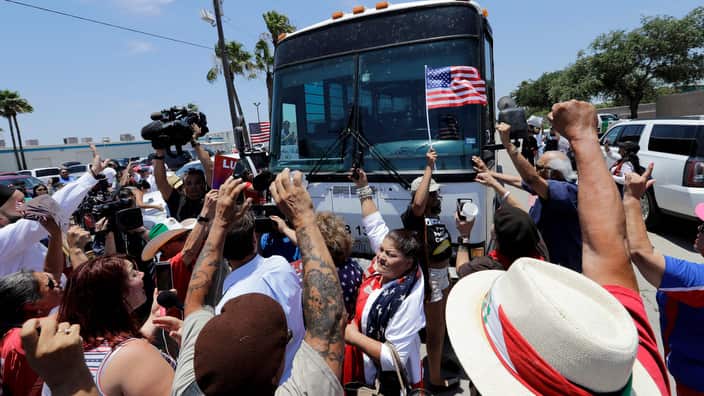 Demonstrators block a bus with immigrant children onboard during a protest in McAllen, Texas on June 23, 2018. 