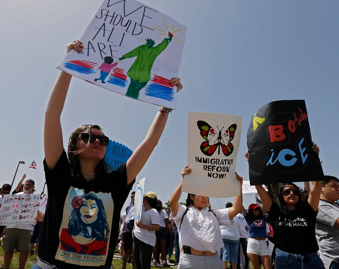 People protest outside a Border Patrol office during a rally in Texas.