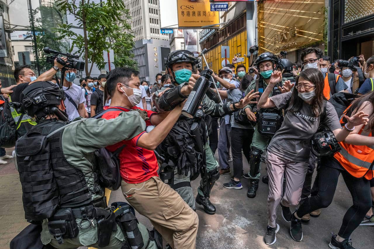 Riot police clash with antigovernment protesters in Hong Kong on May 27, 2020. 
