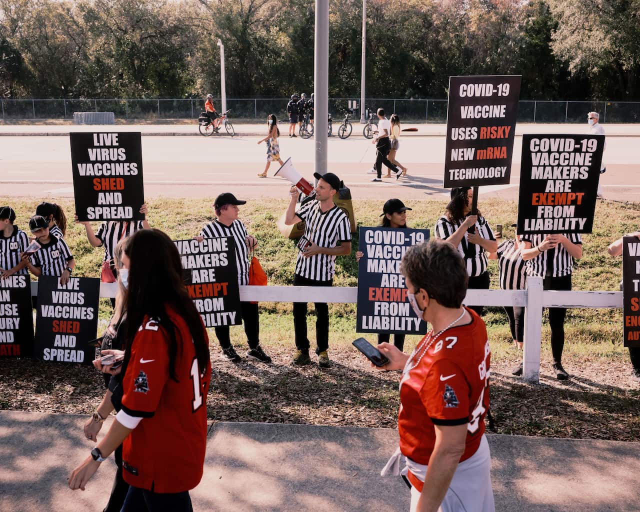 People protesting against the coronavirus vaccines outside the Raymond James Stadium in Tampa, Florida, 7 February, 2021