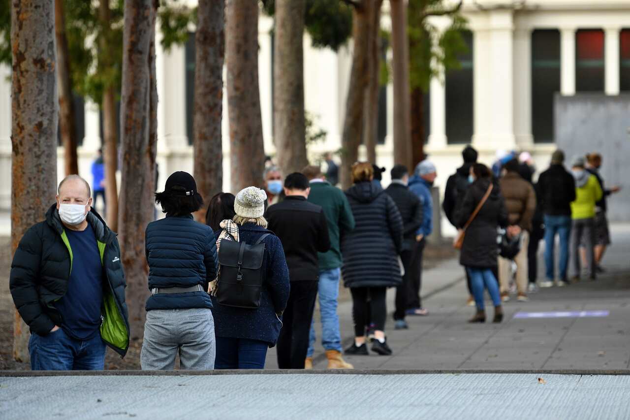 People are seen lining up outside of COVID-19 vaccination centre in Melbourne on 1 June 2021.  