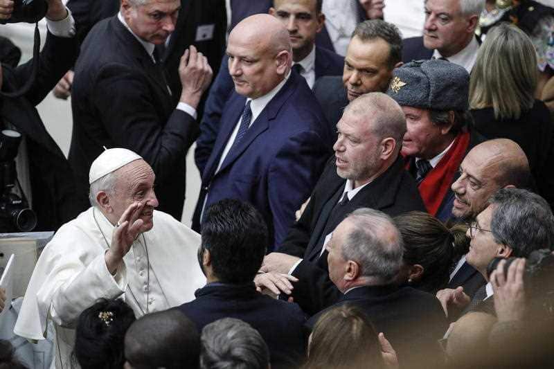 Pope Francis greets the faithful during his weekly general audience in the Paolo VI Hall at the Vatican.
