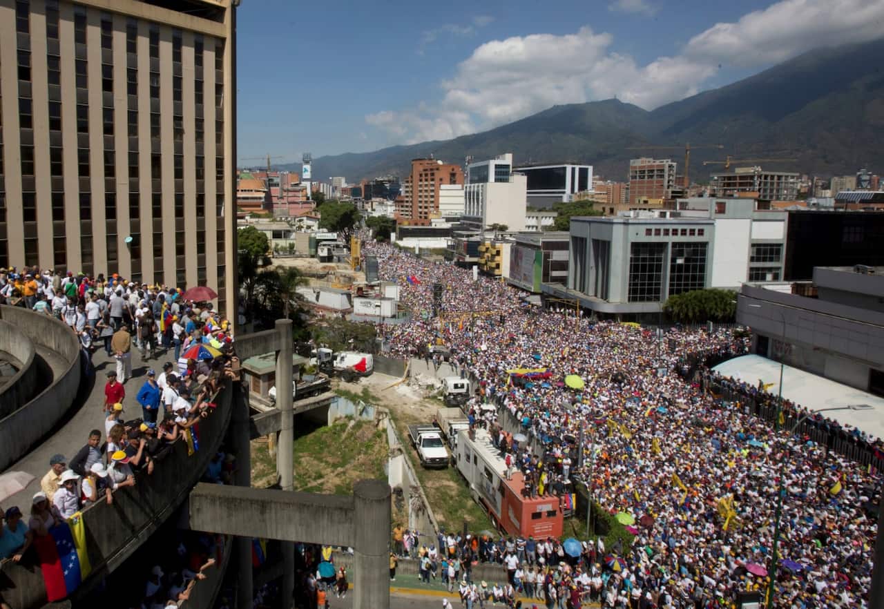 Anti-government protesters take part in a demonstration demanding the resignation of President Nicolas Maduro, in Caracas, Venezuela.