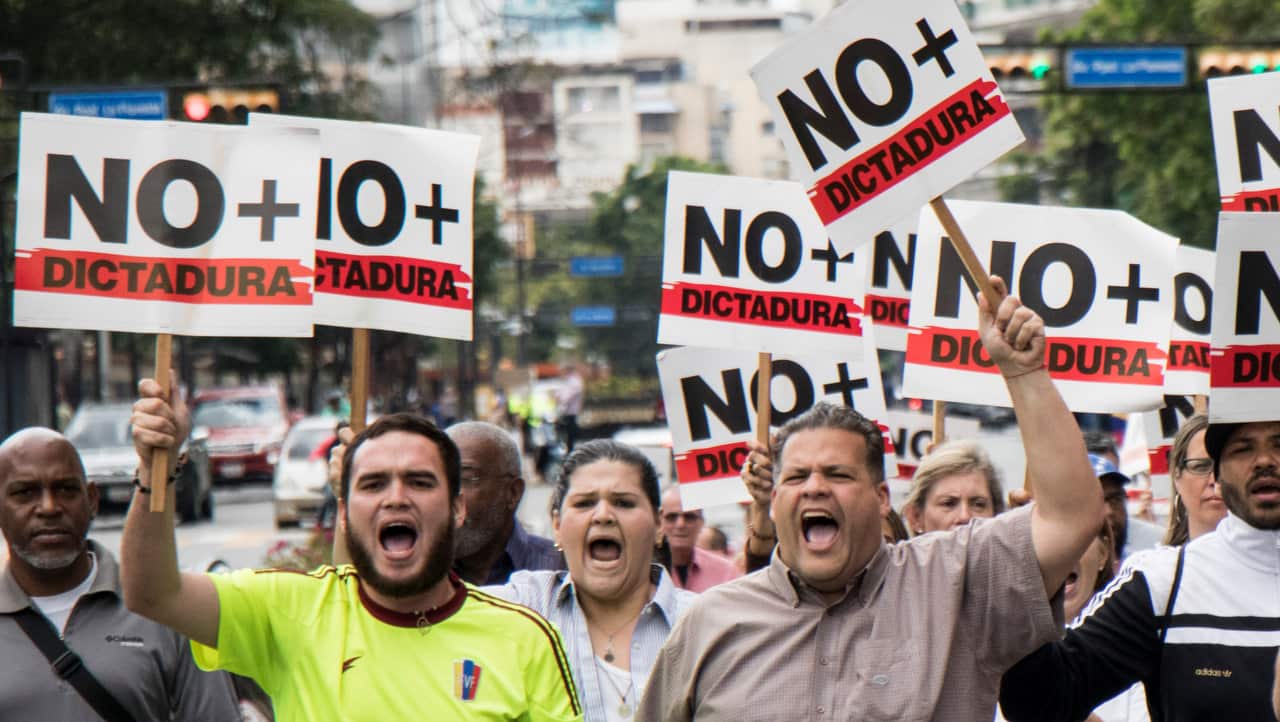 Opposition demonstrators take part in protest against the government of President Nicolas Maduro, called by Juan Guaido on 30/1/19.