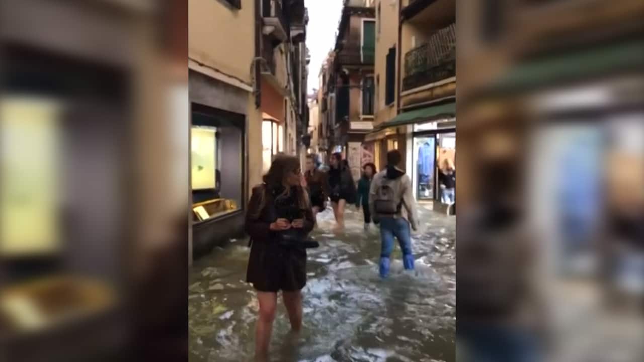 People struggling in the flooded streets as the wild weather moves on.