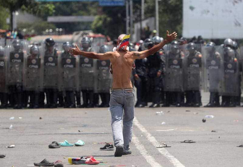 Opposition protesters face the Venezuelan Police at the Simon Bolivar International Bridge in Cucuta, Colombia.