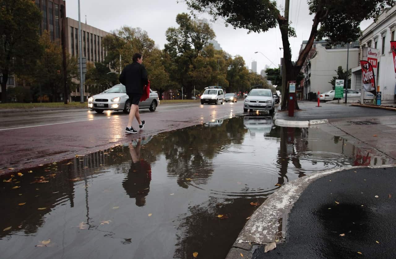 Standing water is seen on Victoria Parade in Melbourne, Friday, May 11, 2018.