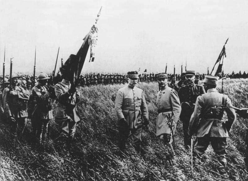 General Petain decorating the colours of a Moroccan regiment during the First World War. 