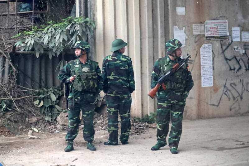 Vietnamese soldiers guard the border station of Dong Dang, where North Korean leader Kim Jong-un is expected to pass through ahead of the summit.