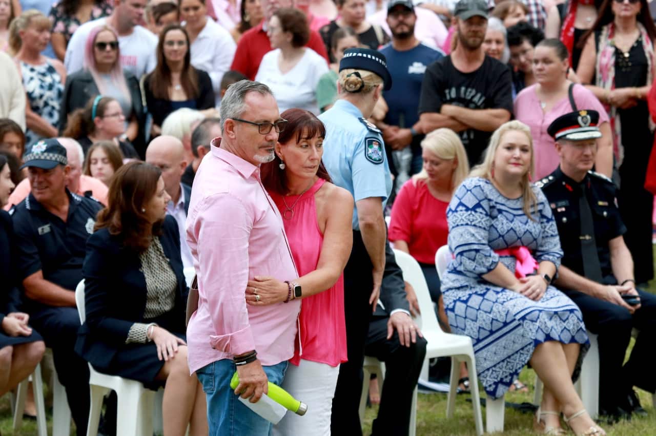 Hannah Clarks parents Lloyd and Suzanne Clark embrace during a vigil for Hannah Clarke and her three children.