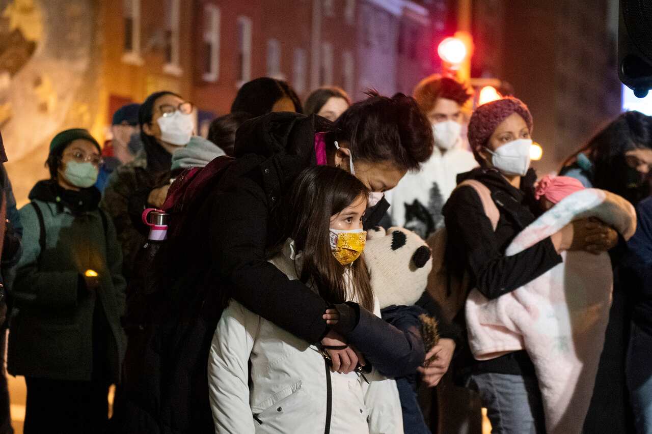 Community members gather for a vigil to mourn and confront the rising violence against Asian Americans at the 10th Street Plaza in Philadelphia.